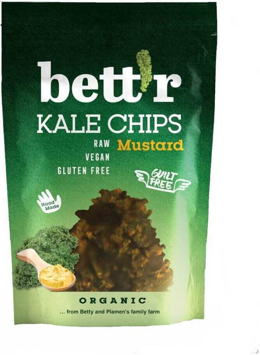 Bio Grünkohlchips von BETTR, glutenfrei, 30 g, mit einer Scheibe grünem, knusprigem Grünkohl auf dem Bild.