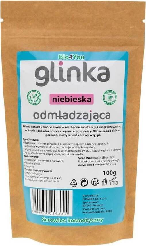Blaue verjüngende kosmetische Tonerde von BIOMIKA, 100 g, in einer offenen Schale mit Tonerde und natürlichen Inhaltsstoffen.