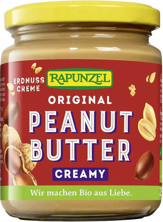 Bio Erdnusscreme mit Meersalz von RAPUNZEL, 250 g, in einem Glas, zeigt die cremige Erdnussbutter mit Meersalzkörnern.