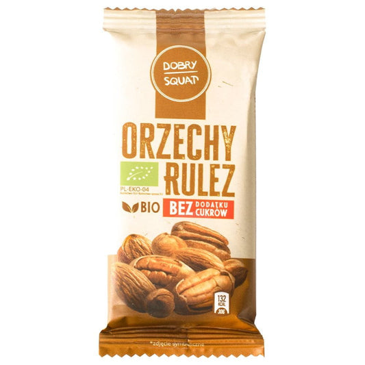 Dattelriegel mit Nüssen von DOBRY SQUAT, BIO, 30 g, zeigt den Riegel mit Nüssen und Datteln auf der Verpackung.