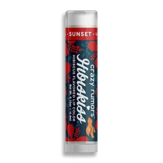 Getönter Lippenbalsam Sonnenuntergang von CRAZY RUMORS, zeigt den Lippenbalsam in einer offenen Verpackung mit sommerlichem Sonnenuntergang-Design.