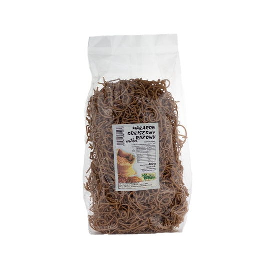 Dinkel- und Vollkornnudelfäden von PRO NATURA, 400 g, ungekocht, in einer transparenten Packung auf weißem Hintergrund.