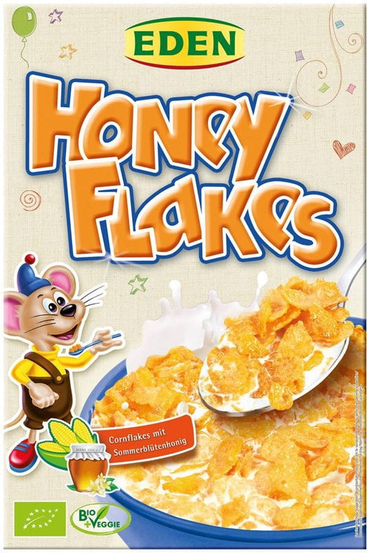 Bio Cornflakes mit Honig von EDEN in einer Schüssel, Nahaufnahme der knusprigen, goldenen Frühstückscornflakes mit Honig.
